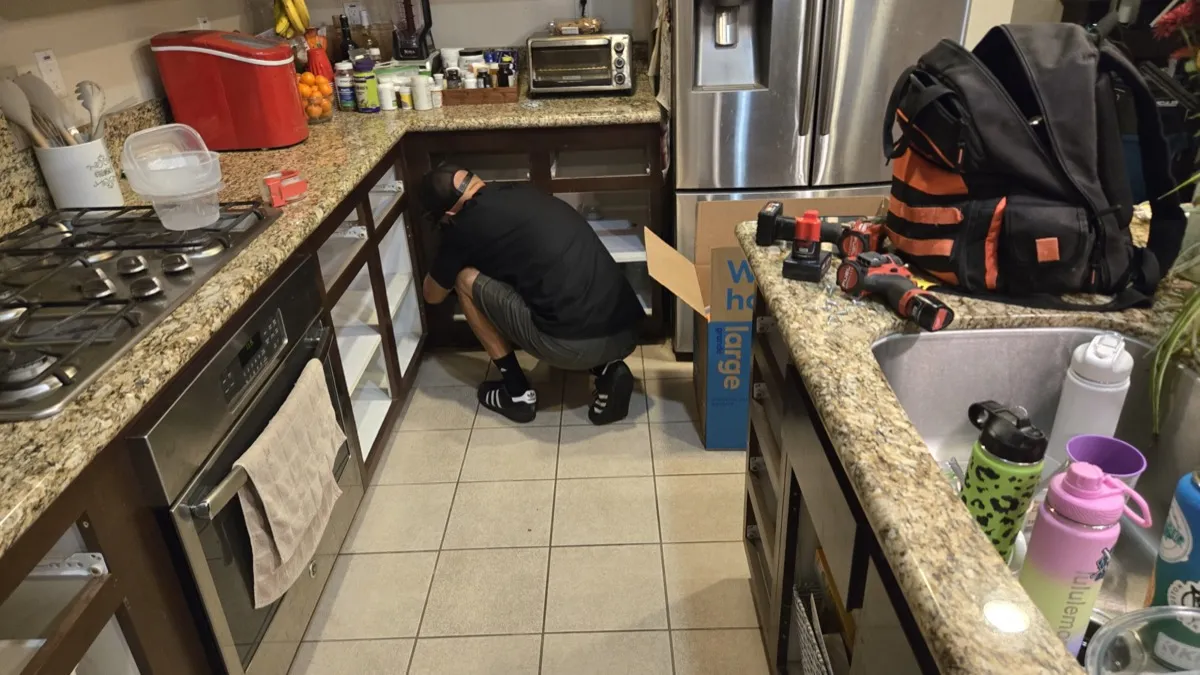 RCR Environmental technician performing kitchen cabinet rebuild after mold remediation