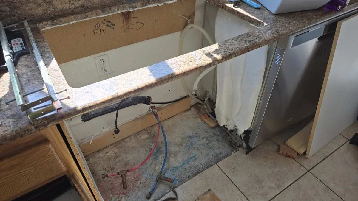 Kitchen sink cabinet stripped during mold remediation
