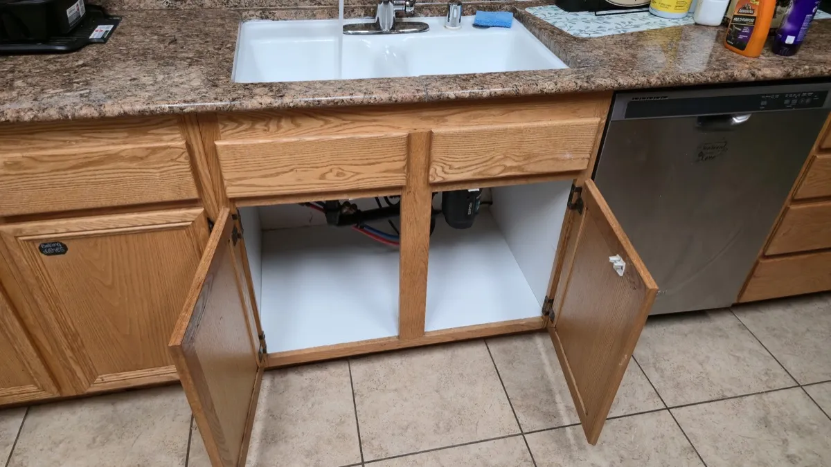 Completed kitchen sink cabinet rebuild with original faces retained